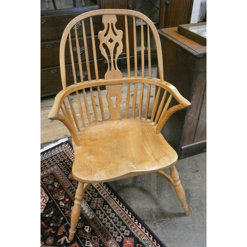 173 - An elm Windsor spindle back elbow chair