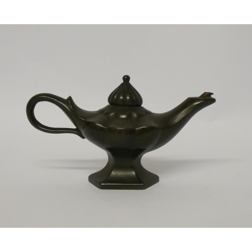 263 - An early 20th century bronze Aladdin's lamp table lighter