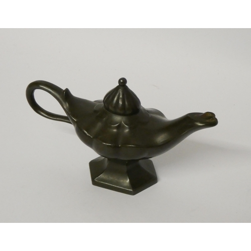 263 - An early 20th century bronze Aladdin's lamp table lighter