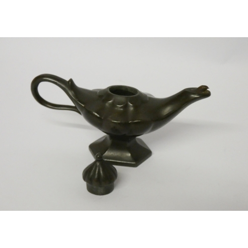 263 - An early 20th century bronze Aladdin's lamp table lighter