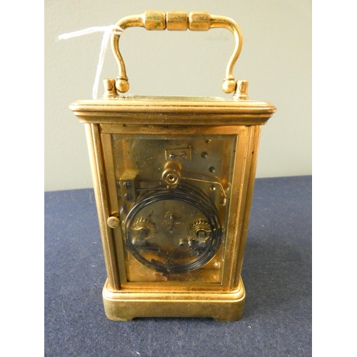 219 - A large striking gilt brass carriage clock