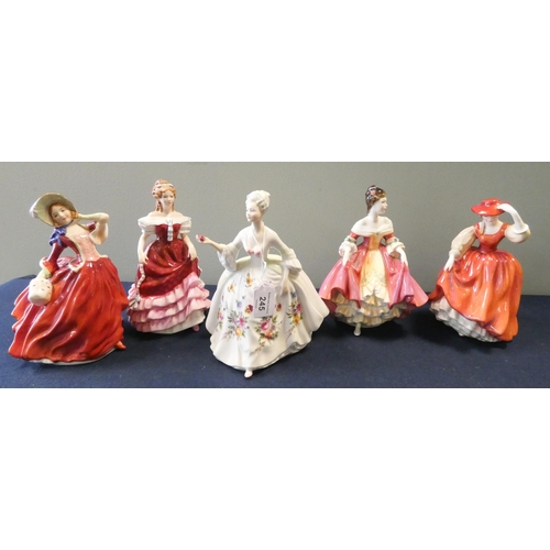 245 - A collection of five Royal Doulton lady figures: 'Autumn Breezes', 'Buttercup', 'Diana', 'Southern B... 