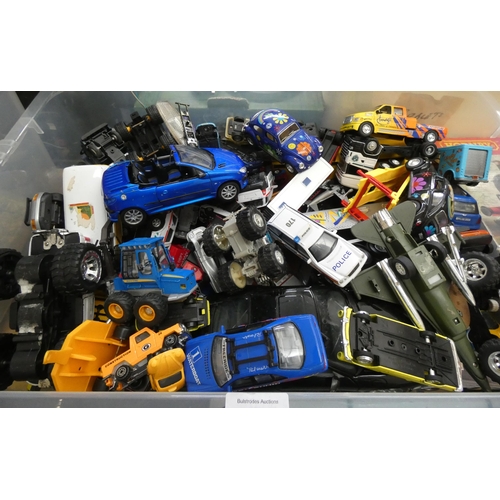 373 - A large box containing played with model vehicles etc