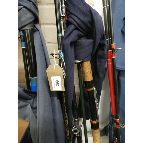 399 - Seven assorted sea fishing rods and a rod bag containing other accessories