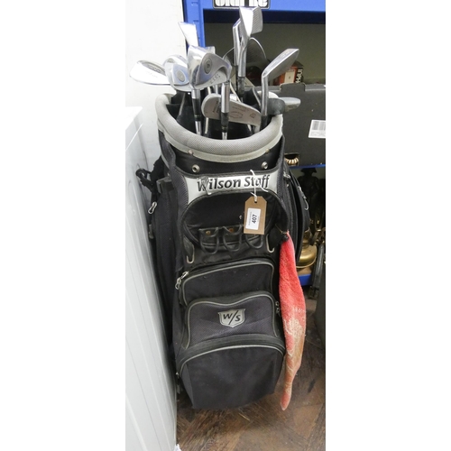 407 - A set of Wilson 1200 bladed golf clubs in a Wilson golf bag