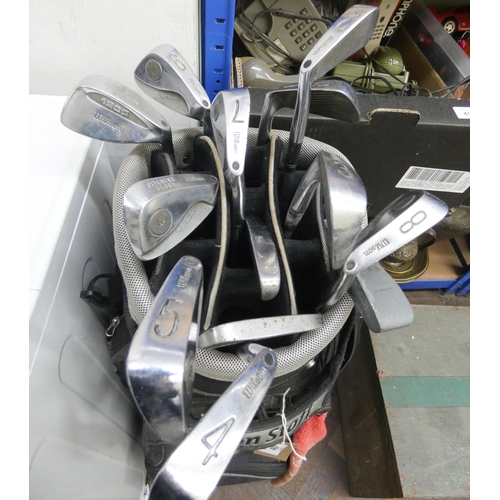 407 - A set of Wilson 1200 bladed golf clubs in a Wilson golf bag