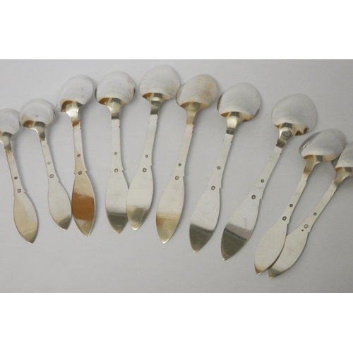 661 - Danish silver - set of six Art Deco hammered finish table spoons and four dessert spoons, three towe... 