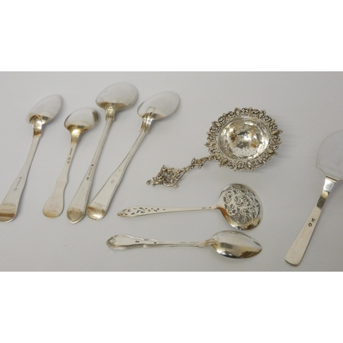 663 - Danish silver - a collection of flatware, strainer, ornate sifting spoon etc. Gross weight 8 oz.