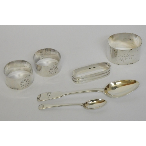 674 - A collection of four assorted silver napkin rings and two silver spoons, gross weight 3.8 troy oz