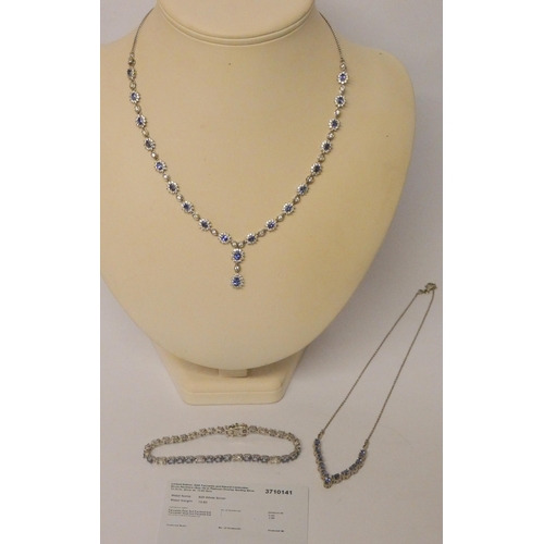 551 - Tanzanite and CZ silver cluster necklace, wishbone necklace and a line bracelet.