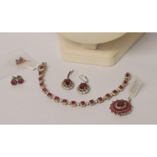 560 - Pair of Rubellite 9ct gold stud earrings, African ruby and zircon line bracelet, ornate ruby and sil... 