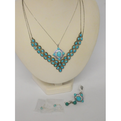 585 - Silver and turquoise V-shaped pendant necklace, silver cluster pendant and matching dress ring toget... 