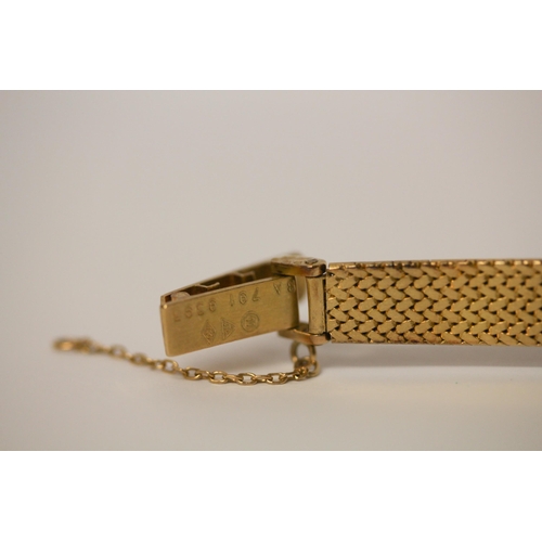 601 - Omega - a ladies 18ct yellow gold quartz dress watch on 18ct gold hallmarked bracelet strap, BA 791 ... 