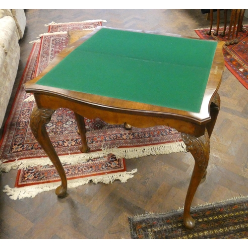 324 - An early 20th century Burr walnut fold over top card table on cabriole legs, 2'9 wide