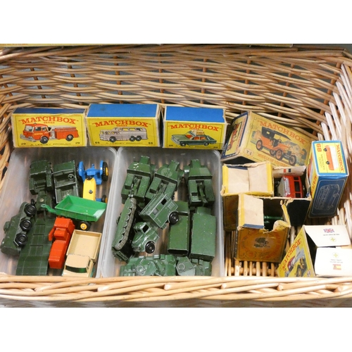 285 - A small collection of Matchbox series model vehicles in boxes together with some military vehicles e... 