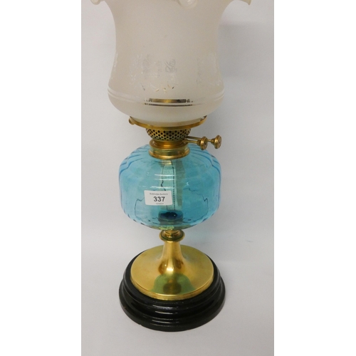 337 - A Victorian brass oil lamp with blue glass reservoir