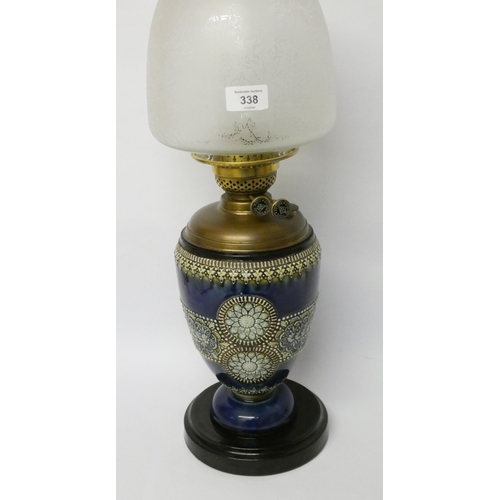 338 - A royal Doulton stoneware oil lamp with glass shade