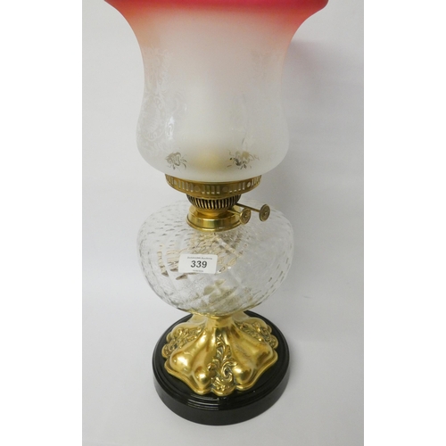 339 - Ornate Victorian brass oil  lamp with pink tinged glass shade