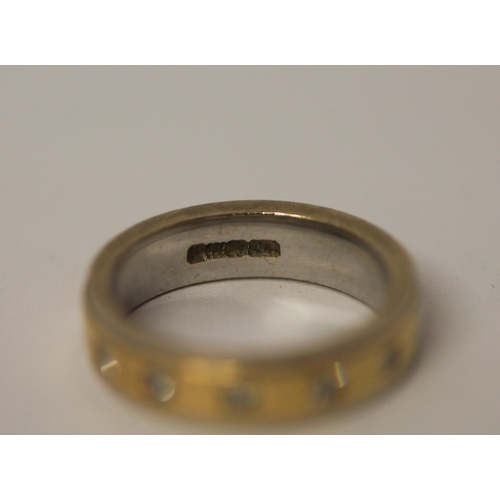 502 - 18ct bi-colour gold wedding band or eternity ring, set with five diamonds, hallmarked, ring size J/K... 