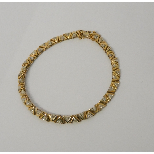 508 - Modern 9ct yellow gold and diamond bracelet, clasp hallmarked. Gross weight 9.2g, length 19.5cms