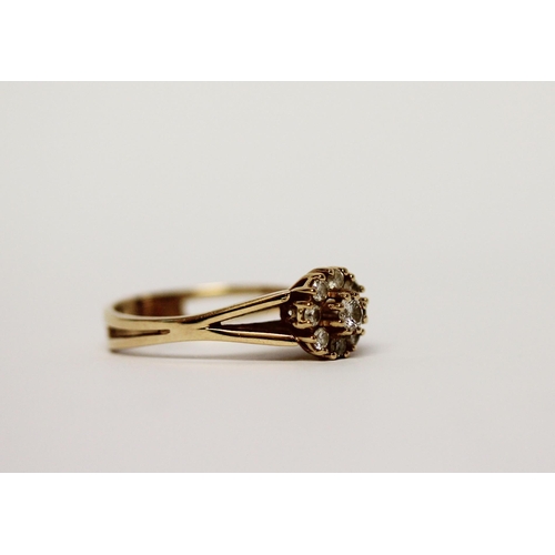 538 - A modern diamond daisy cluster ring, set with brilliant cut diamonds on 14ct yellow gold band, Marke... 