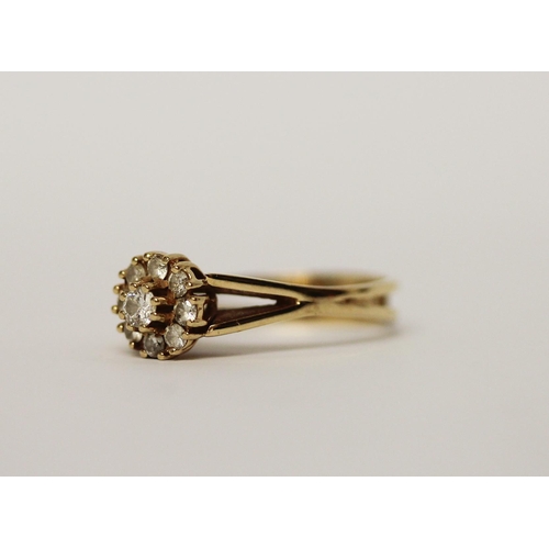 538 - A modern diamond daisy cluster ring, set with brilliant cut diamonds on 14ct yellow gold band, Marke... 