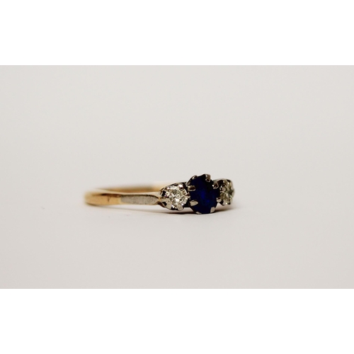 543 - A three stone sapphire and diamond ring on unmarked yellow gold band. Gross weight 2.4g. ring size R