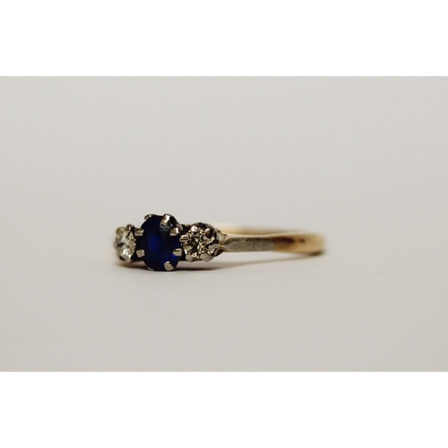 543 - A three stone sapphire and diamond ring on unmarked yellow gold band. Gross weight 2.4g. ring size R