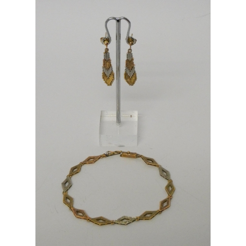 544 - A modern 9ct tri-colour gold pair of drop earrings and a tri-colour 9ct gold diamond link bracelet, ... 