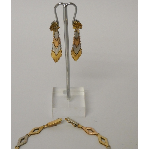 544 - A modern 9ct tri-colour gold pair of drop earrings and a tri-colour 9ct gold diamond link bracelet, ... 