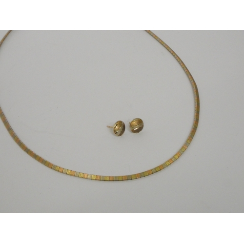 545 - A 9ct tri-colour gold choker length necklace, marked 9ct, 42 cms long approx, together with a pair o... 