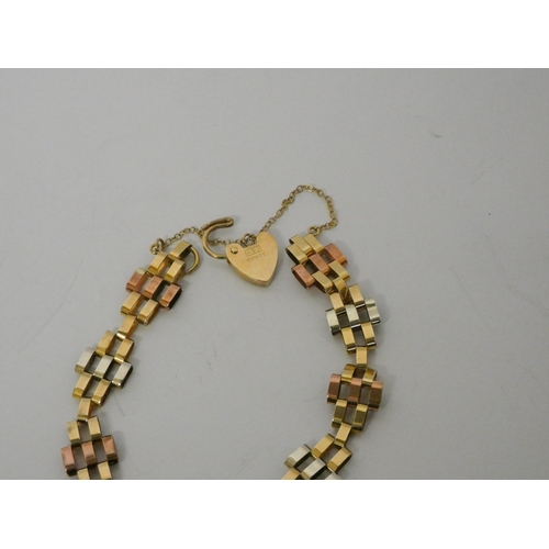 546 - A tricolour 9ct gold gate style bracelet with safety chain and heart shaped padlock fastening, hallm... 