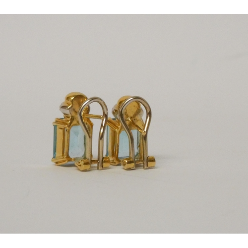 549 - A pair of 18ct gold blue topaz and diamond earrings, on hallmarked post and omega fittings, Gross we... 