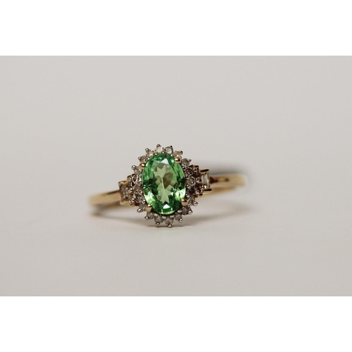 590 - 9ct peridot and diamond oval cluster dress ring, size M.