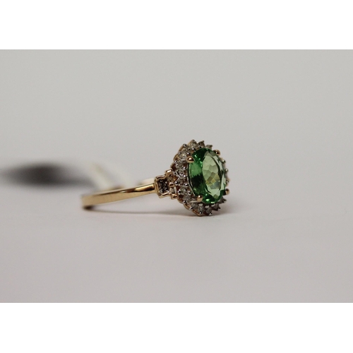 590 - 9ct peridot and diamond oval cluster dress ring, size M.