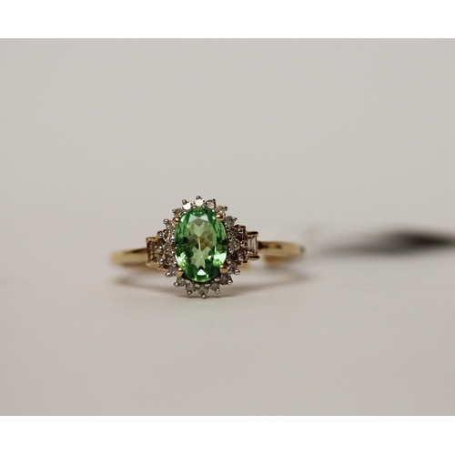 590 - 9ct peridot and diamond oval cluster dress ring, size M.