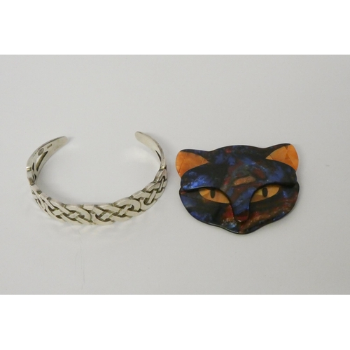 613 - Lea Stein - a plastic cat face brooch, of angular stylised form, stamped 'Lea Stein Paris' to unders... 