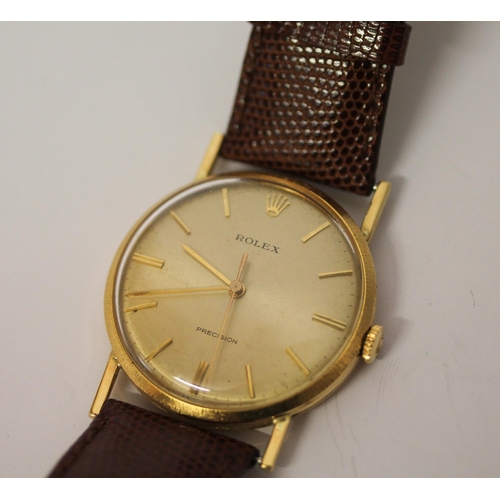 617 - Gold Rolex Precision vintage 18ct gold wristwatch
with champagne dial and gold hands on a brown leat... 