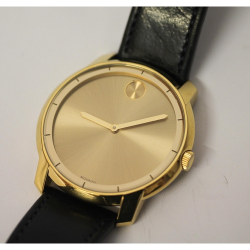 621 - Movado Bold gold plated 43mm dial dress watch, stainless steel case, and black leather strap