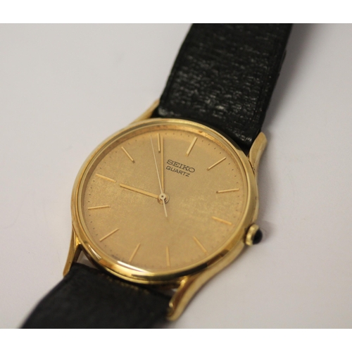 636 - Seiko - gent's gold plated dress watch with quartz movement on black leather strap