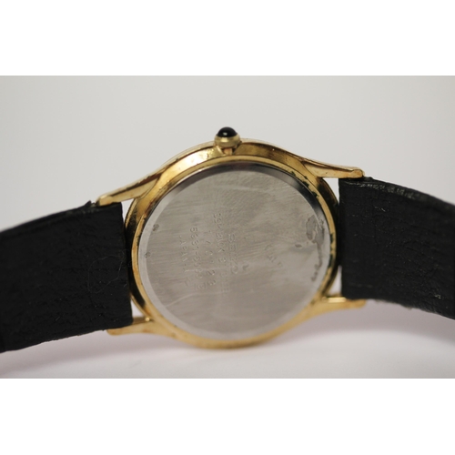 636 - Seiko - gent's gold plated dress watch with quartz movement on black leather strap