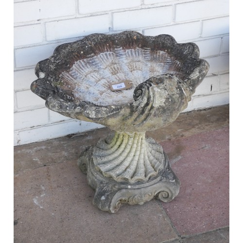 466 - A Victorian style reconstituted stone shell shaped garden bird bath on a decorative base