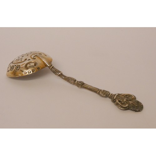 642 - An ornate Victorian silver sifting spoon, Hallmarked London 1894, 1.8 troy oz