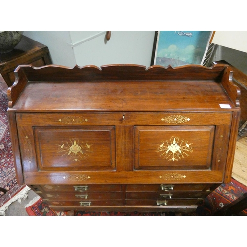 192 - A Chinese brass inlaid hardwood bureau with six drawers under standing on cabriole legged stand, 37