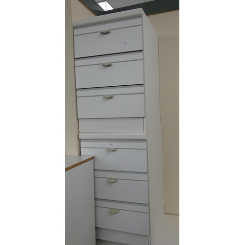 9 - A pair of modern white three drawer bedside chests