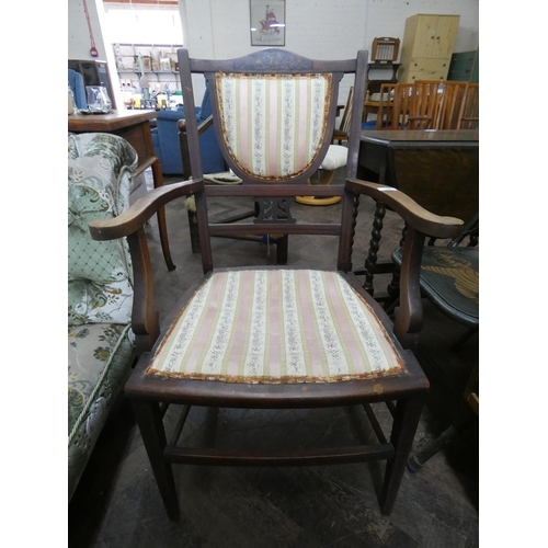 52 - An Edwardian inlaid mahogany elbow chair with upholstered seat and back pad