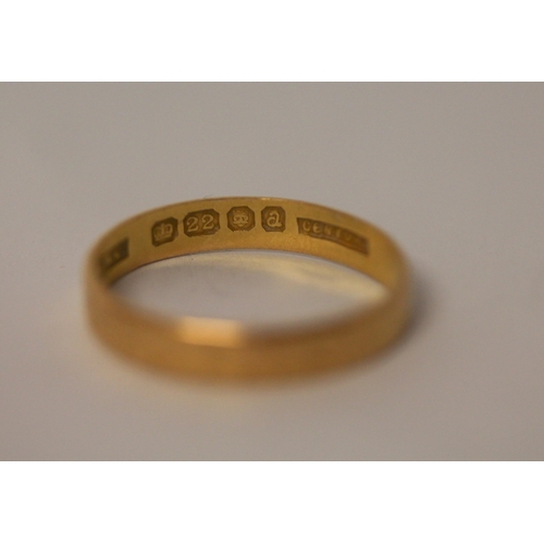 590 - A 22ct gold wedding band, size L, gross weight 2.1g