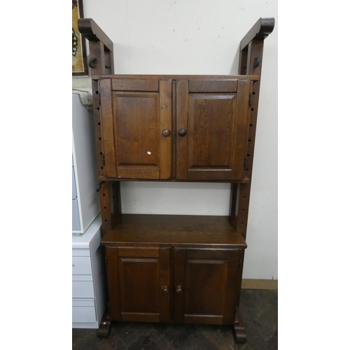 12 - A continental oak cabinet fitted top cupboards and cupboards under, 3'6 wide