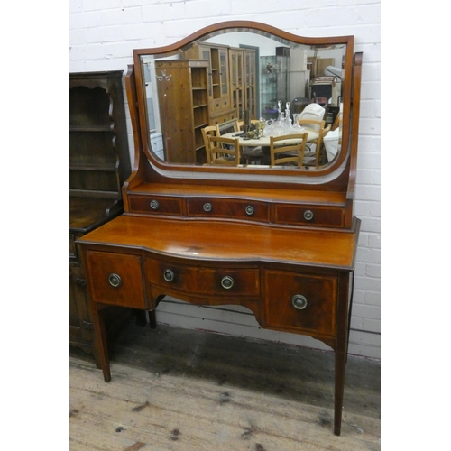 26 - An Edwardian inlaid mahogany shaped front kneehole dressing table fitted three drawers and a mirror ... 