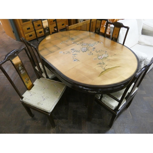 49 - Chinese gold and floral lacquered oval dining table with two extra centre leaves together with six m... 